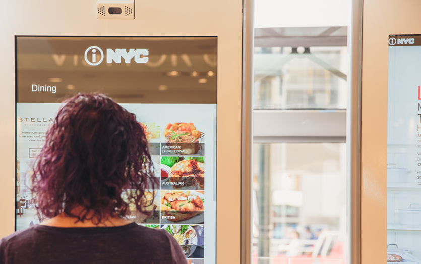 Visitor interacting with a Macy’s kiosk