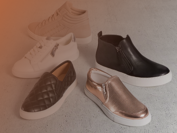 Payless shoes arranged on a warm neutral background